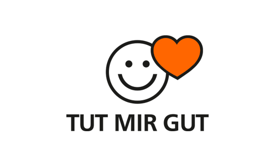 Ein lächelnder Smiley mit rotem Herz und dem Schriftzug: Tut mir gut